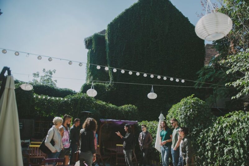 Bucharest Alternative Walking Tour - The Rare Wall Painting of Square Cat and the Cinema Capitol Garden
