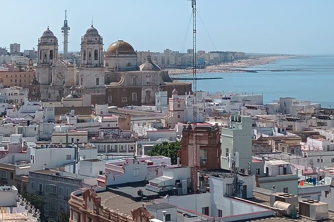 Cadiz Food Tour: Tapas, Drinks and Delights with a Local - Leaning on Torre Tavira and Tasting Papas aliñás