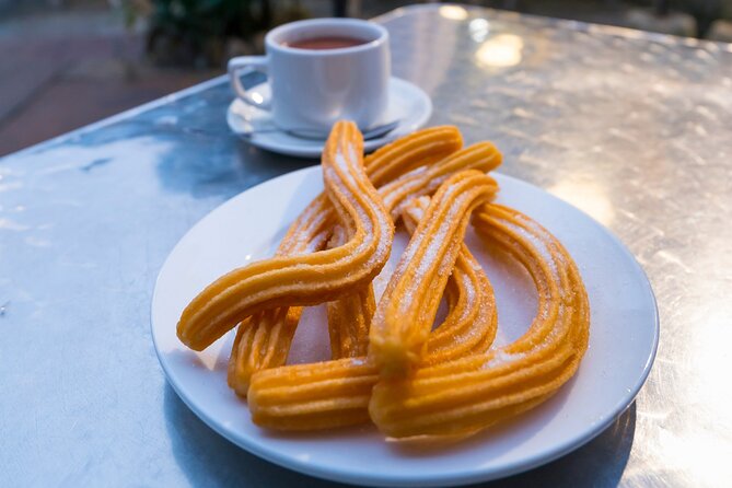 Cadiz Food Tour: Tapas, Drinks and Delights with a Local - Visiting Mercado Central and Enjoying Churros con Chocolate