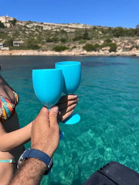 Cagliari: Boat Cruise with Stops for Swimming and Prosecco - The Skipper and Guide Experience