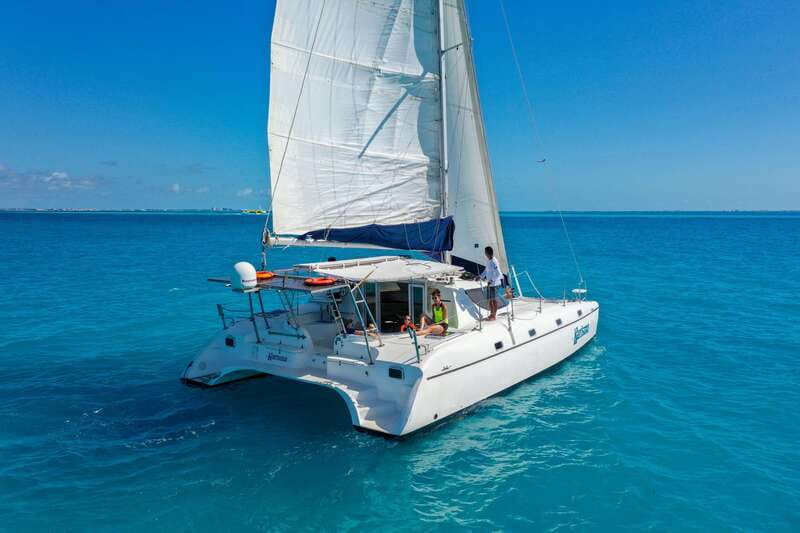 Cancun: Half Day Private Catamaran with Snorkeling. 25 guest - Relaxing at North Beach on Isla Mujeres