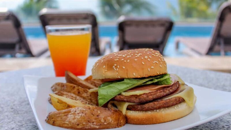 Cancun: Isla Mujeres Royal Garrafon with Transport & Lunch - Relax in the Oceanfront Infinity Pool with Scenic Views