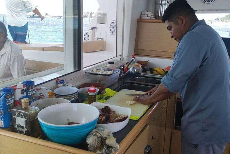 Cancun: Private Luxury Catamaran to Isla Mujeres - Fishing and Paddleboarding in Calm Caribbean Waters