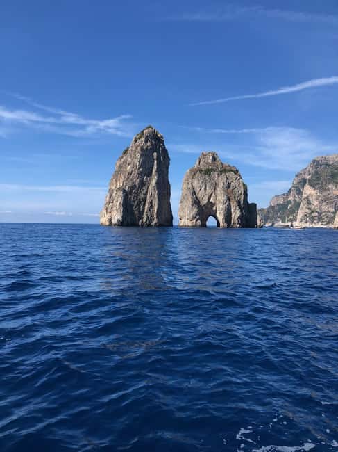 Capri Day Trip from Sorrento private boat free drink - The Famous Faraglioni and Green Grotto Stops
