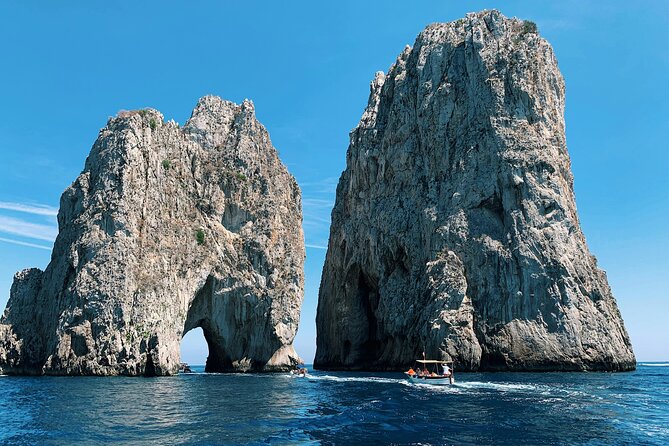 Capri Private Boat Excursion with Faraglioni and Blue Grotto - Navigating Capri’s Iconic Rock Formations and Caves