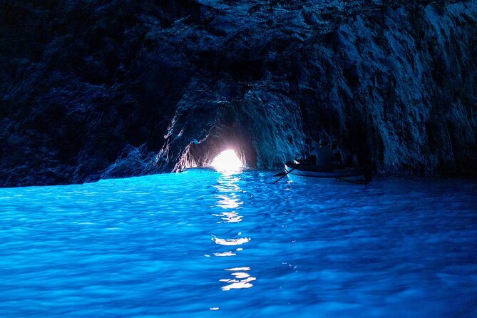 Capri Private Boat Excursion with Faraglioni and Blue Grotto - Swimming, Snorkeling, and Relaxing on Deck