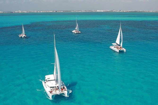 Catamaran adventure to Isla Mujeres with Snorkel,Buffet,Open Bar and Beach Club - Snorkeling and Reef Exploration Options