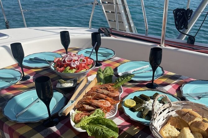 Catamaran cruise in Mykonos with Meal, Drinks & Transport - Dining on Board: Traditional Greek Cuisine and Homemade Wine