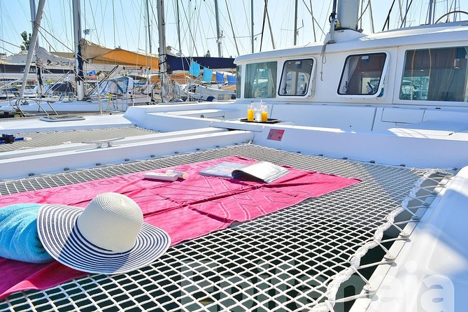 Catamaran cruise in Mykonos with Meal, Drinks & Transport - Practical Details: Group Size, Booking, and Cancellation