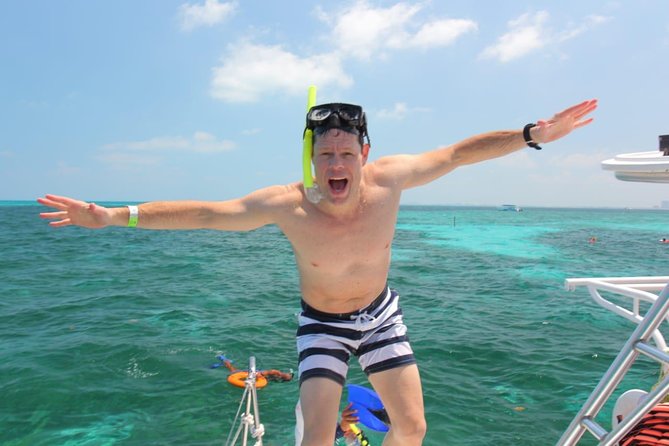 Catamaran Sailing Experience & Snorkeling Tour to Isla Mujeres - Food and Drinks: A Beachside Buffet and Unlimited Beers