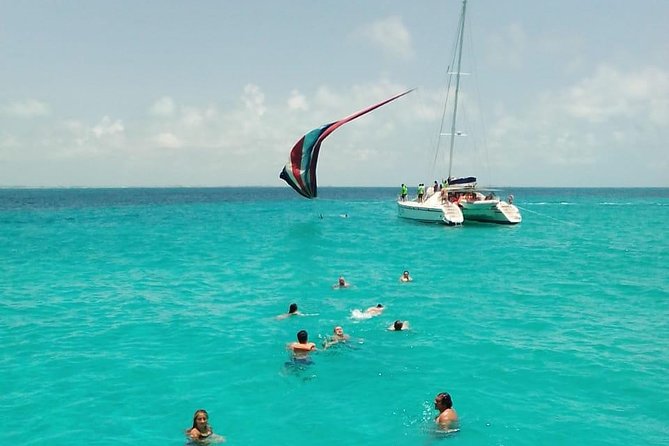 Catamaran to Isla Mujeres, Open bar, buffet, Beach Club Included - What’s Not Included and Additional Costs