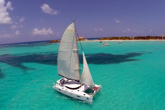 Catamaran Tour to Isla Mujeres, Open bar, Lunch, Snorkeling, Beach Club Included - Sunset Sailing and Onboard Entertainment