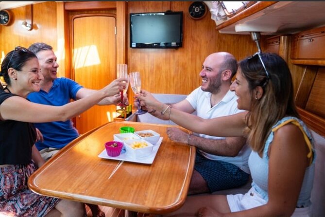 Catania boat tour along the coast with aperitif and snorkeling - Sicilian Aperitif with Local Specialties