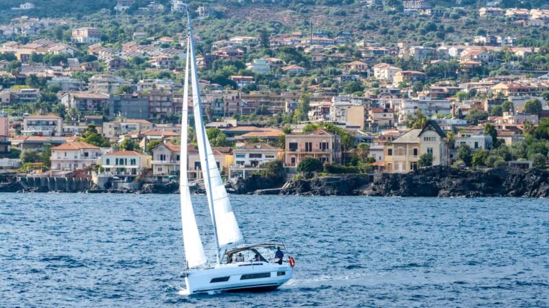 Catania: Sail Tour of Cyclops Coast with Sicilian Aperitif - Guides, Atmosphere, and Personal Touches