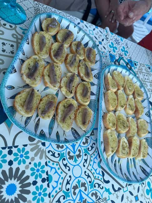 Cefalù: sunset coast tour with snorkeling and aperitif - Sunset Aperitif with Local Products and Scenic Views