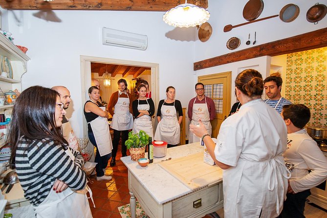 Cesarine: Market Tour & Cooking Class at Local's Home in Lucca - Sampling Local Wines with Your Homemade Meal