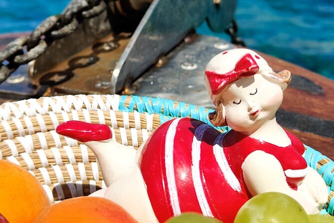 Classic boat tour to Tavolara and Molara with lunch. - Exploring the Erosion-Formed Arch of Orecchio di Ulisse