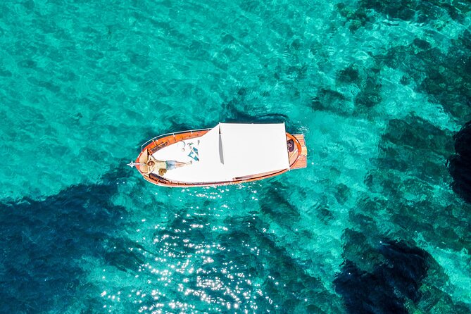 Classic boat tour to Tavolara and Molara with lunch. - Relaxing Dip at Cala Girgolu