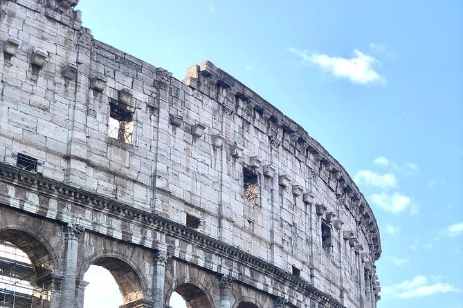 Colosseum Tour with Palatine Hill and Roman Forum - Walking through the Roman Forum’s lively history