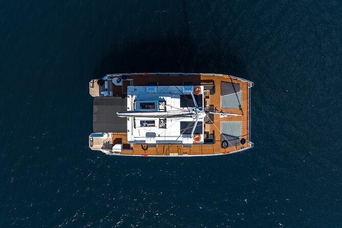 Comfort Max Catamaran Caldera Cruise with BBQ and Drinks - Starting Point at Barbarossa Sailing in Ammoudi Bay