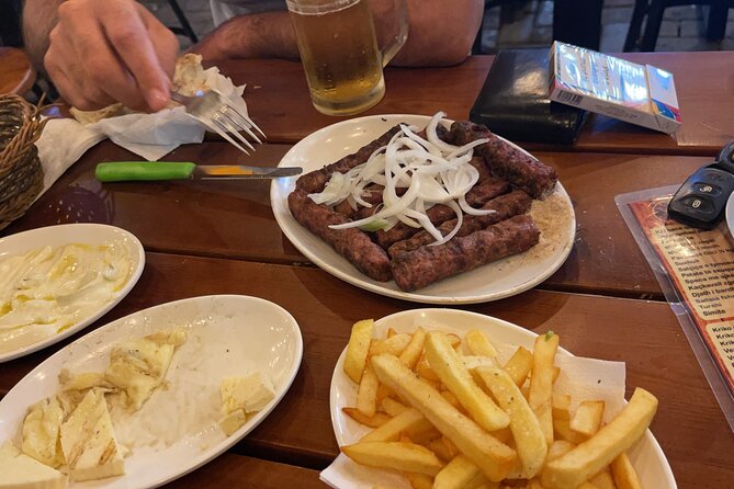 Communist History Tour Tirana & Street Food - Walking Through Skanderbeg Square and Its Historic Buildings