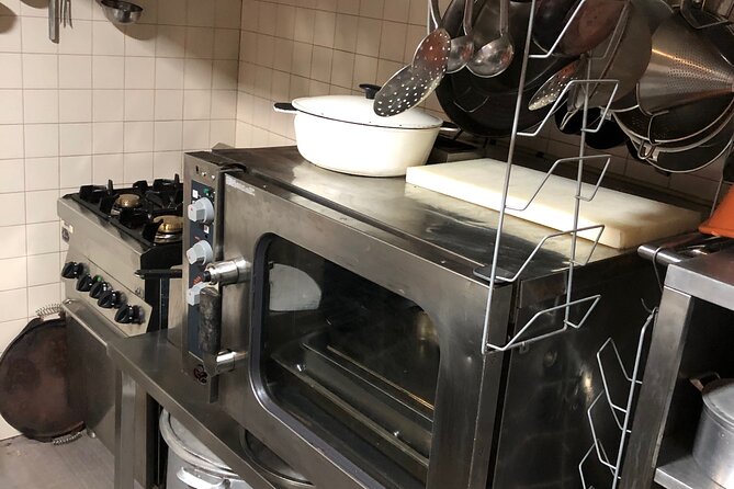 Cook Cod Fish as a Local in Traditional Place - Key Points