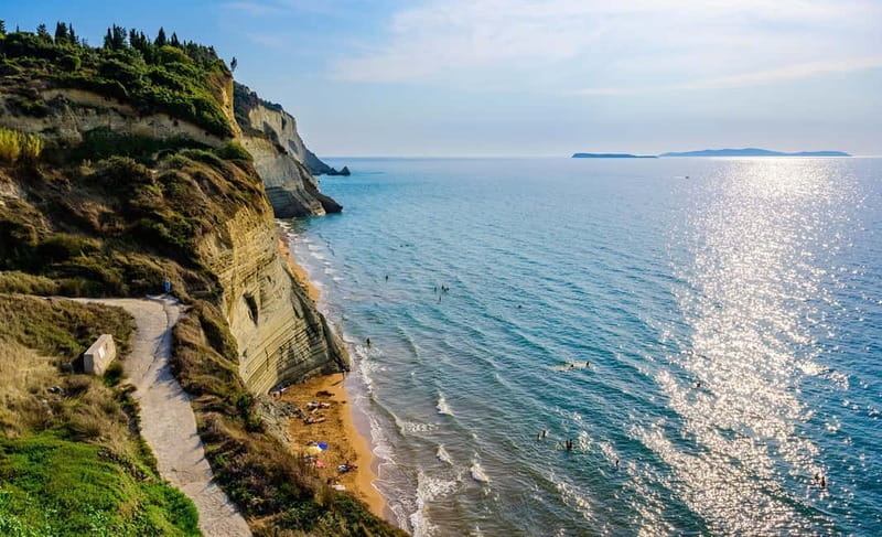 Corfu: Palaiokastritsa Swimming and Loggas Beach Sunset Tour - The Loggas Beach and Its Limestone Cliffs