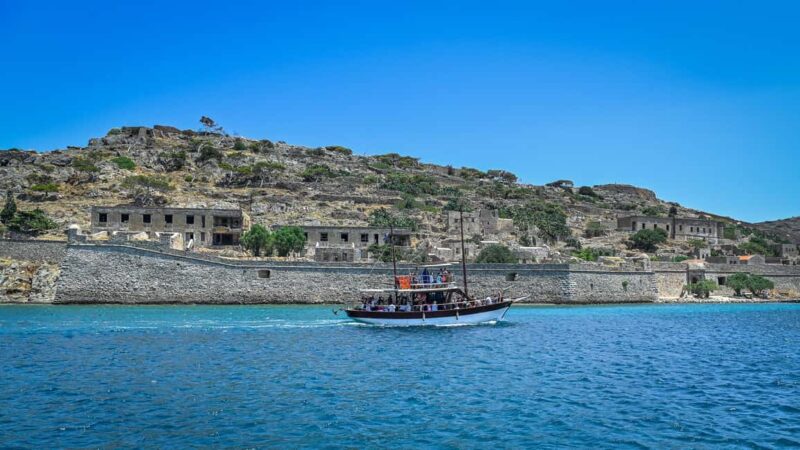 Crete: Boat Trip to Spinalonga and Kolokytha Beach - Relaxing at Kolokytha Beach and Its Lush Backdrop