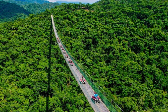 Cross the vehicle bridge with waterfall in RZR ATV - Discover the Thrill of Crossing the Worlds Longest Vehicle Suspension Bridge