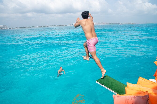 Dancer Cruise Isla Mujeres Snorkel Food and Drinks Included - Return Journey and Onboard Party Scene