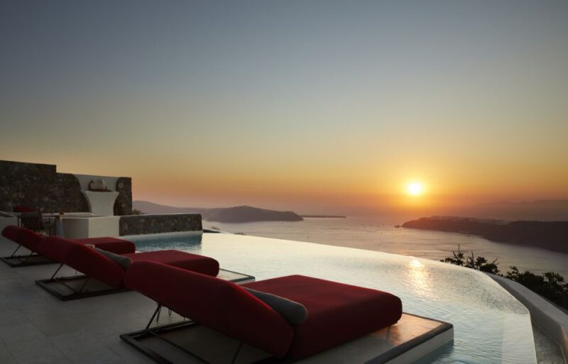 Daybed Relaxation with infinity pool use with caldera views - A Luxurious Daybed Experience with Caldera Views and Infinity Pool Access in Greece