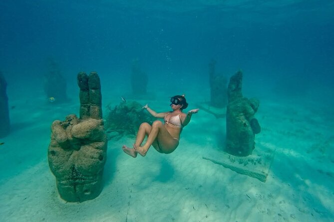 Deluxe Catamaran Tour to Isla Mujeres, from Costa Mujeres Hotels - Snorkeling in Vibrant Coral Gardens