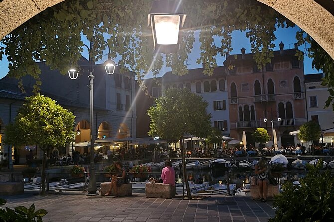 Desenzano Sunset Walking and Boat Tour with a Drink On Board - Climbing the Castello di Desenzano for Lake Views
