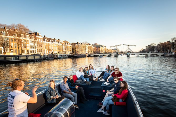Discover Amsterdam's Canals: Relaxing Open Boat Cruise Adventure! - The Role of the Guide and Live Commentary
