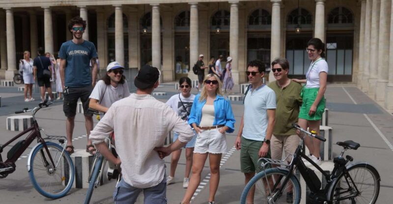 Discover Paris by bike - Passing by the Louvre Museum with a Quick Look