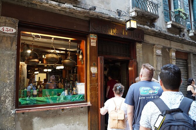 Discover Venice Like a Local: Small Group Cicchetti & Wine Tour - Enjoying Wine and Fresh Cicchetti at Osteria Al Sacro E Profano