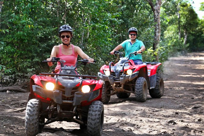 Drive an Atv shared, swim in a Cenote and ziplines in the Cancun - Cancuns Jungle Adventure: ATV Ride and Transportation