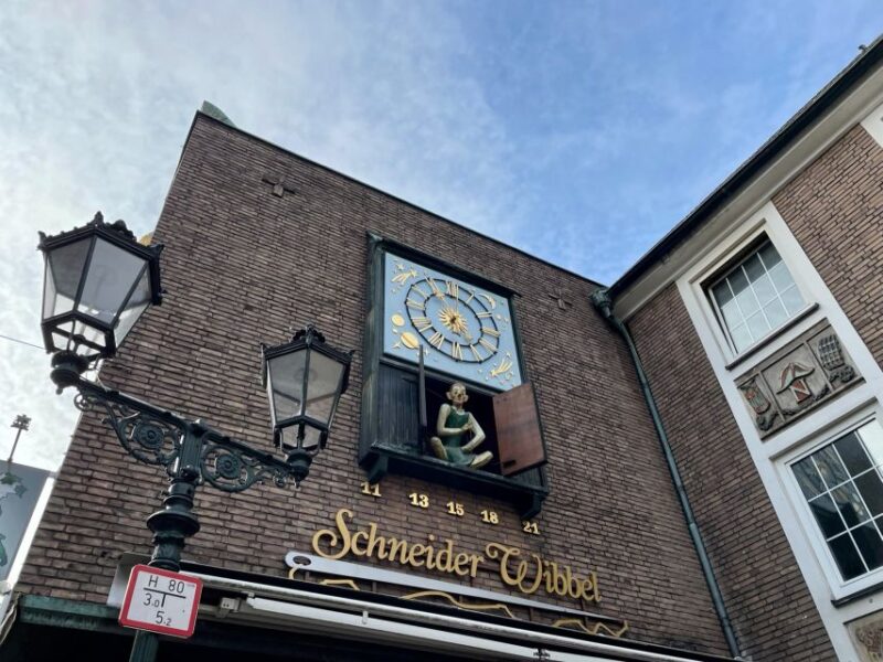 Düsseldorf: Guided Old Town Tour with Beer Break - Discovering High-End Shops and Iconic Landmarks