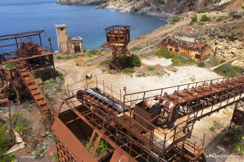 E-biking inside the mine tunnels on Monte Calamita, Capoliveri - Scenic Ride Through Elba’s Unique Red Soil and Natural Landscape