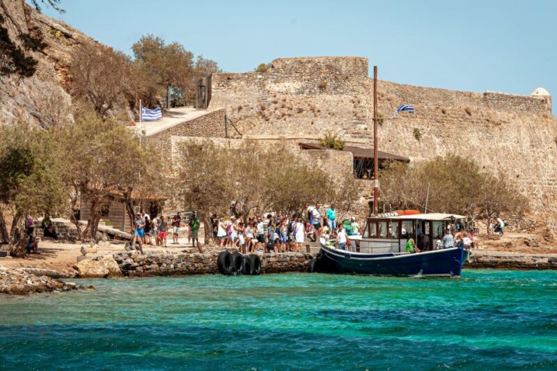Elounda: Spinalonga Guided Boat Tour with BBQ and Swimming - Exploring Spinalonga Islands Venetian Fortress