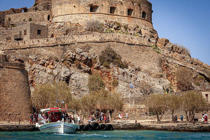 Elounda: Spinalonga Prof. Guided Boat Tour w/ BBQ + Swimming - The Significance of Spinalonga’s Past