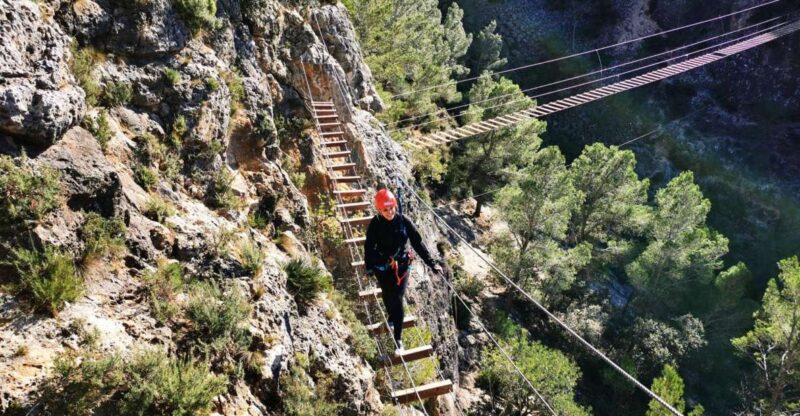 Enguera - Climbing on Vertical Stone Walls with Iron Clamps