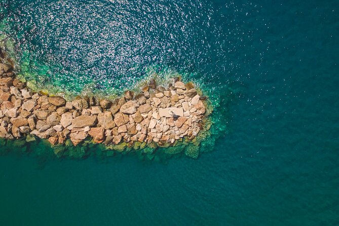 Explore Rina's Cave and Koufonisia Cruise From Naxos - Rinas Cave and Kalandos Beach: The First Stop