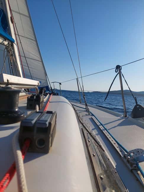 Fertilia: Sunset Sail with a Sardinian Aperitif - Swimming and Snorkeling at the Stop