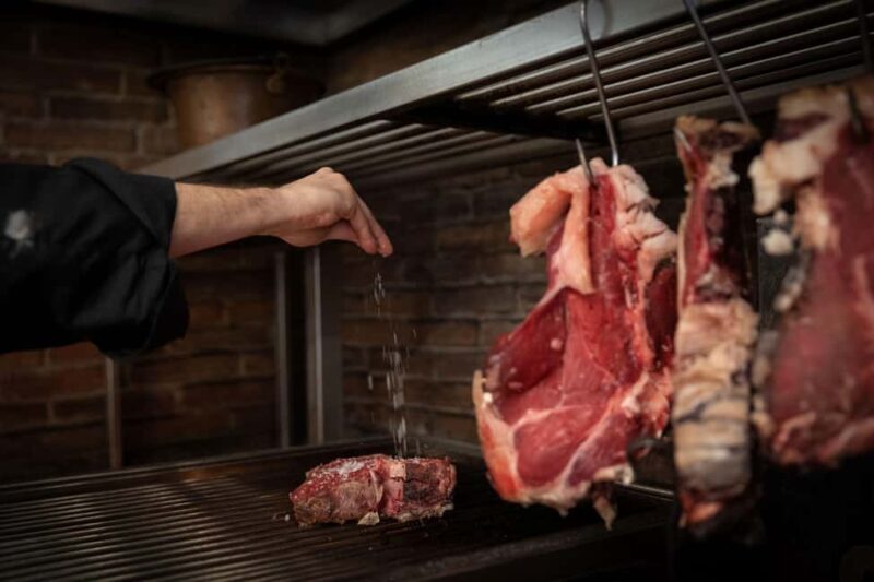 Florence: Live Grill Show & Steak Dinner with Wine - Key Points