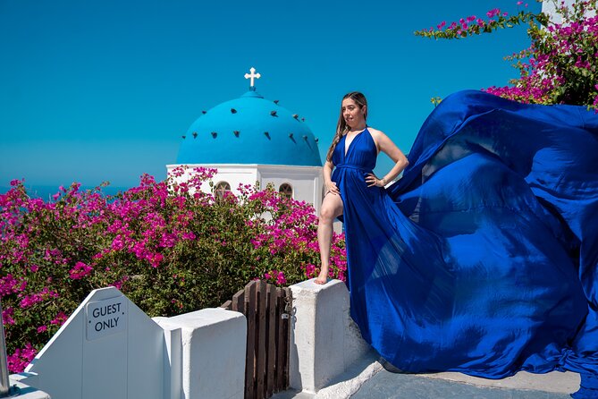 Flying Dress Photoshoot in Oia Private entry to Blue Dome - Pacing and Physical Requirements