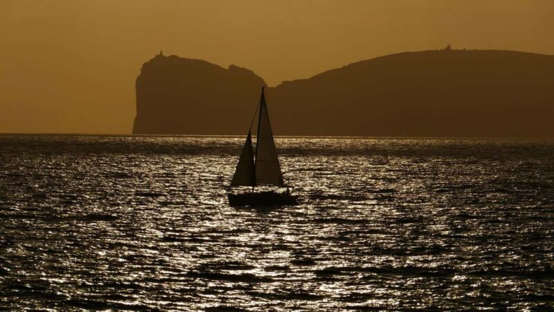 From Alghero: sunset on a sailing boat with aperitif - Swimming and Stargazing During the Night