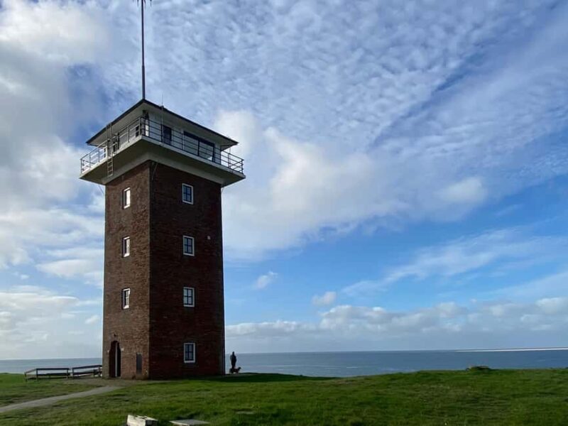From Amsterdam: Dunes, Submarine & Windmills Guided Day Tour - Windmills and Waterways: A Classic Dutch Scene