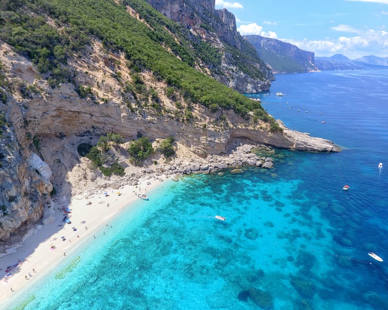 From Arbatax: Full-Day Guided Boat Tour of the Baunei Coast - Visiting Cala Mariolu: Swimming and Snorkeling