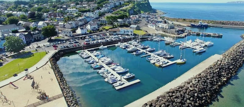 From Belfast: Full-Day Giants Causeway Land and Boat Tour - Visiting an 800-Year-Old Norman Castle